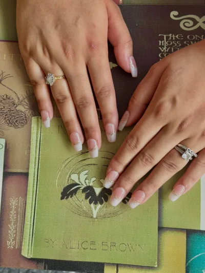 French + Chrome Details Press-On Nails: medium almond nails, sheer nude, white french tips, chrome accents