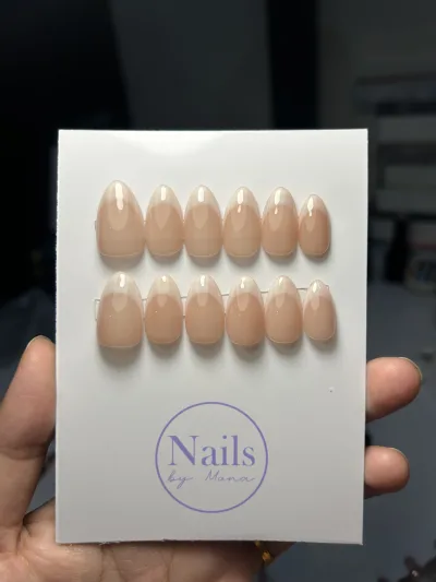 Barely There Nude press-on nails on a card: almond nails in sheer peachy nude